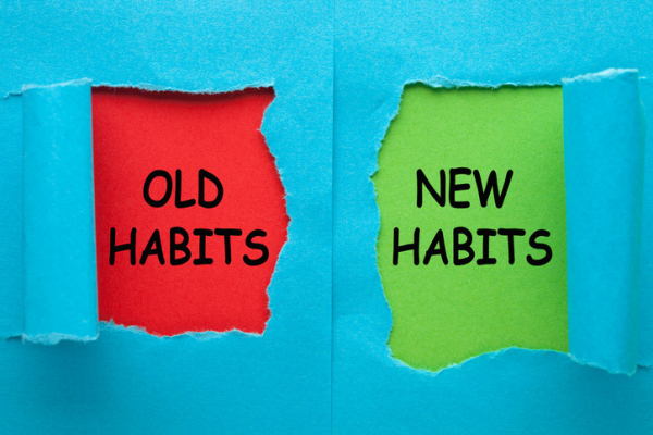 Graphic of the words "old habits" and "new habits" on torn blue paper